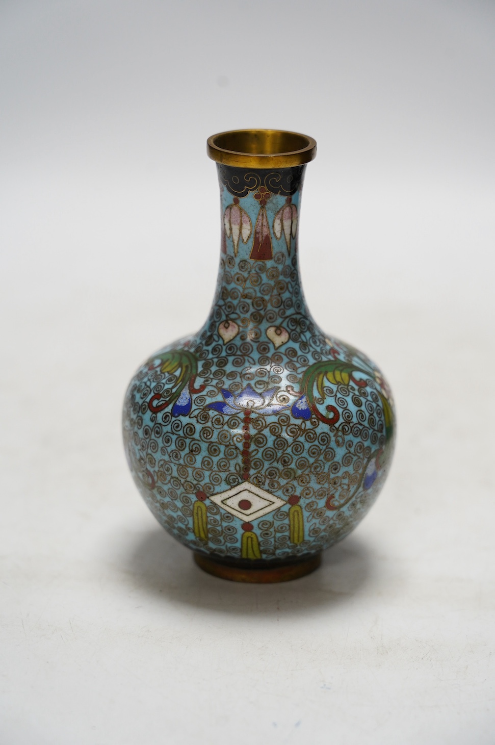 A Chinese cloisonné enamel vase, 13cm, and a set of five graduated lacquer boxes, the lids with inlaid silver decorations, largest 13.5 x 10 x 6.5cm. Condition - good
